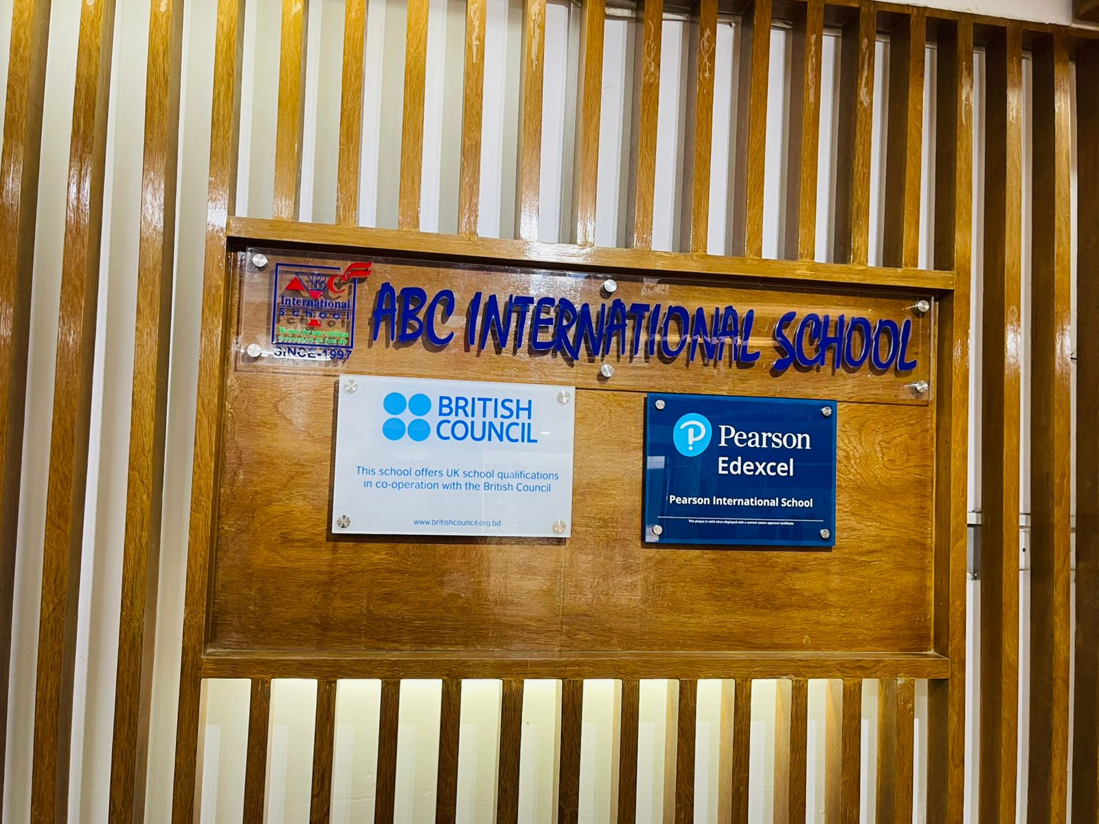 ABC International School Uttara section signboard and academic affiliation display